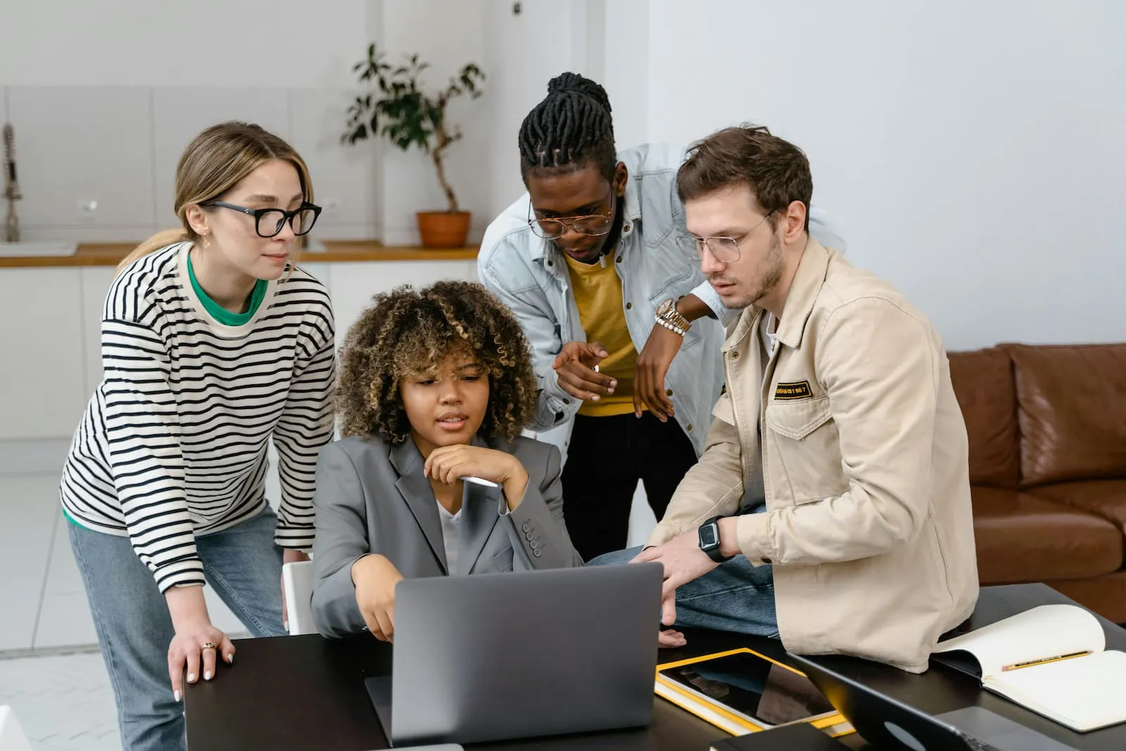 Managers reviewing employee monitoring laws on a laptop