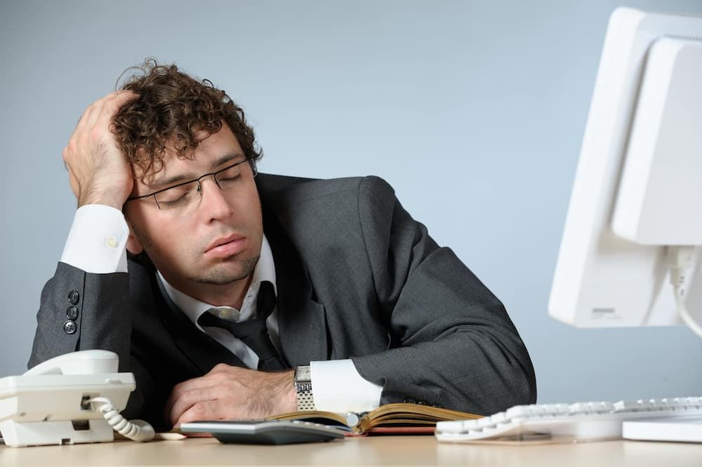 What do employees do in the office instead of working?